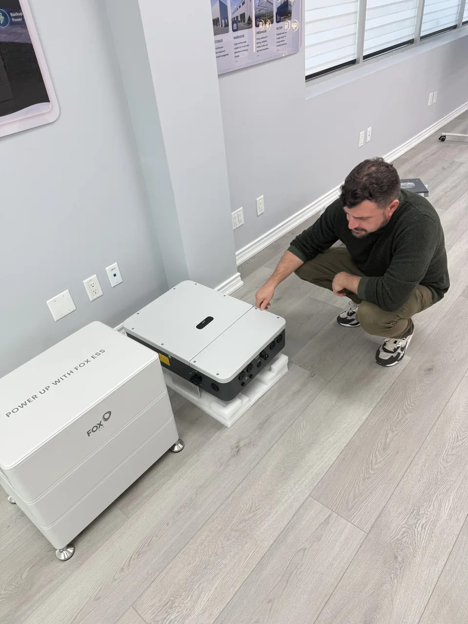 David beside the battery and inverter hardware in our showroom.