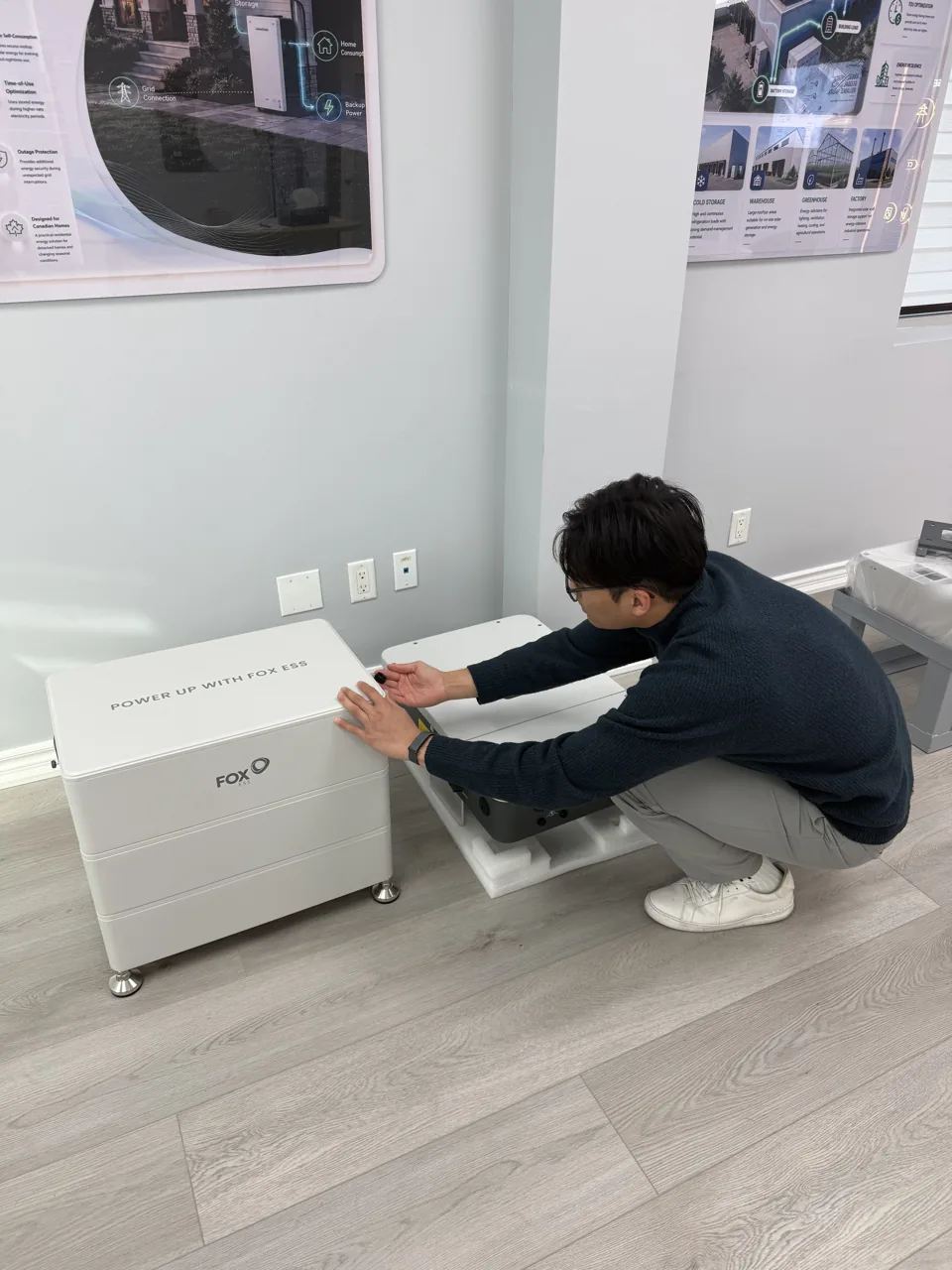 Hunter with the battery and inverter hardware in our showroom.